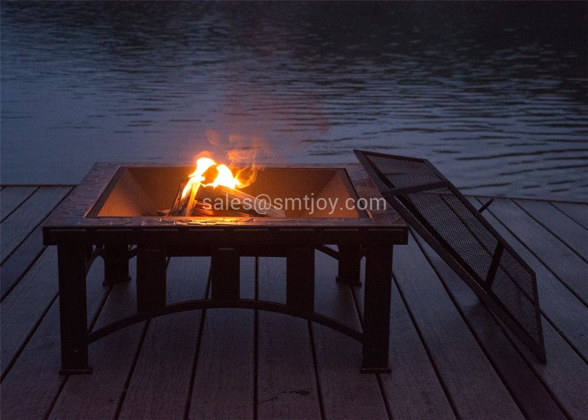 34-inch arch base slate firepit in luxury garden setting